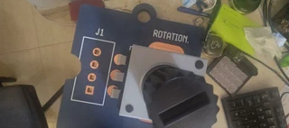Close-up of the finished connector row (J1) next to the knob, with clean copper pads and the decorative pins visible.