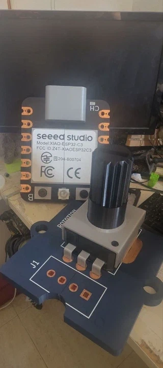 The giant rotary sensor next to a giant XIAO ESP32-C3 board, for scale.
