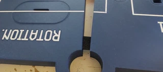 The key piece glued into the seam between two quadrants, bridging the joint.