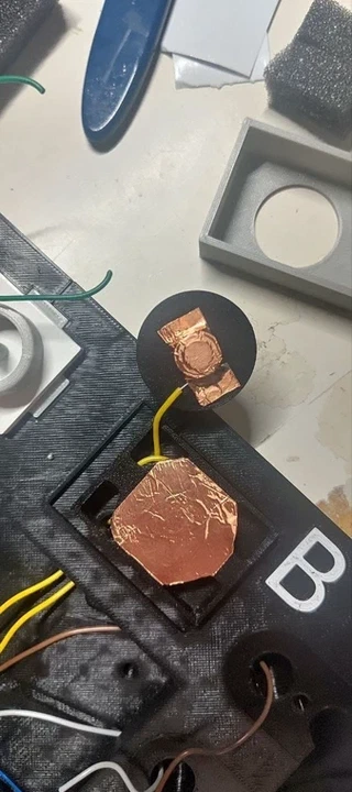 Pin pads with copper tape assembly in progress.