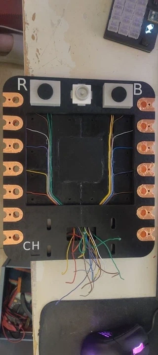 Back of the board showing the internal wiring harness with color-coded wires routed to both sides.