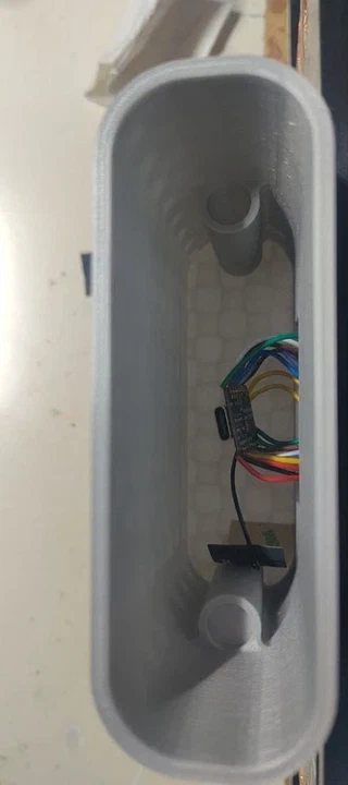 The USB-C shell opened, showing the real XIAO mounted vertically inside.